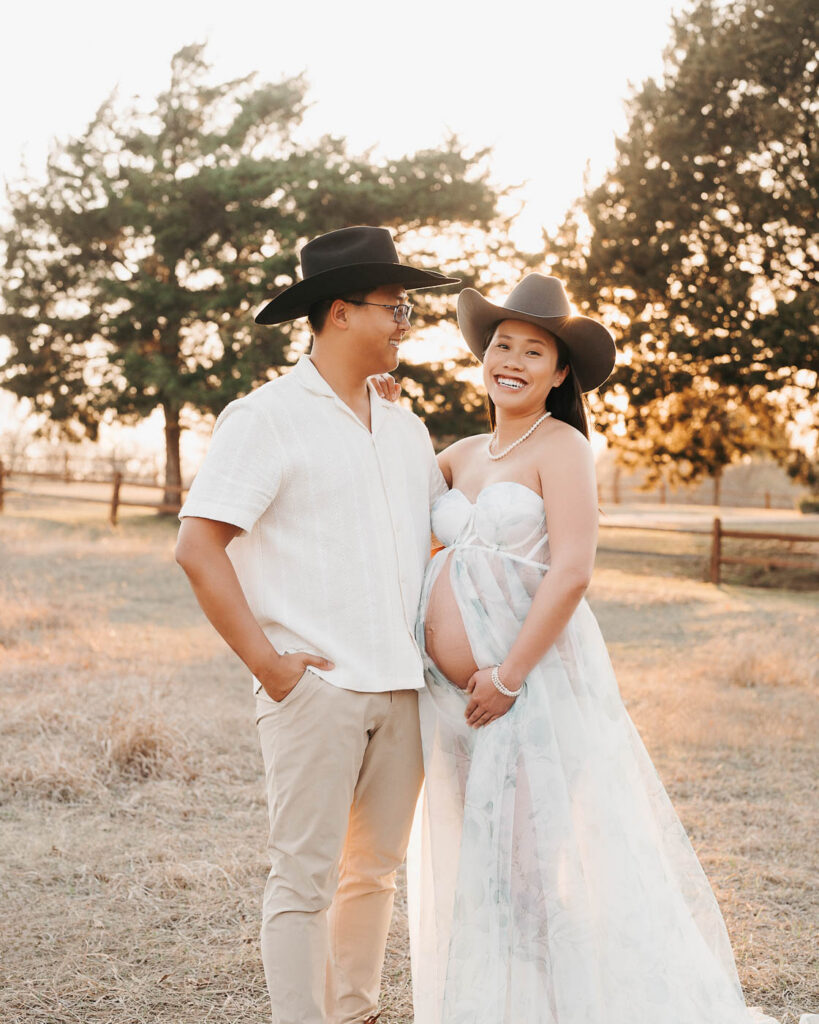 Expecting Couple Smiling Together During Outdoor Maternity Photography Session At Sunset In Dallas