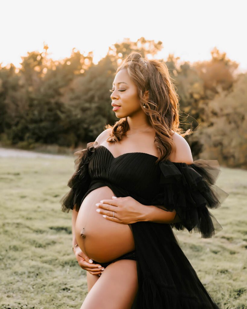 Maternity Photos With Pets: When Your First Baby Joins The Session 11 Maternity Photographer In Dallas Capturing A Close-Up Outdoor Maternity Portrait Highlighting A Growing Baby Bump At Sunset.