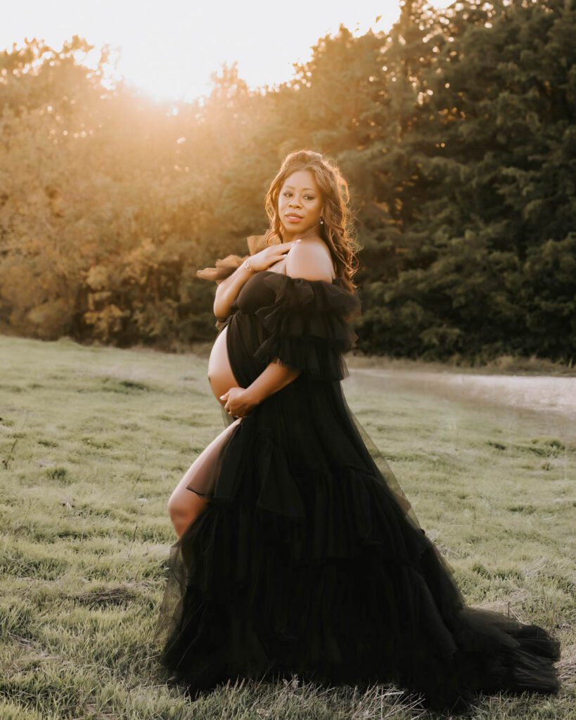 Maternity Photos With Pets: When Your First Baby Joins The Session 10 Sunset Maternity Photos In Dallas Featuring An Expecting Mother In A Flowing Black Maternity Gown Surrounded By Warm Evening Light.