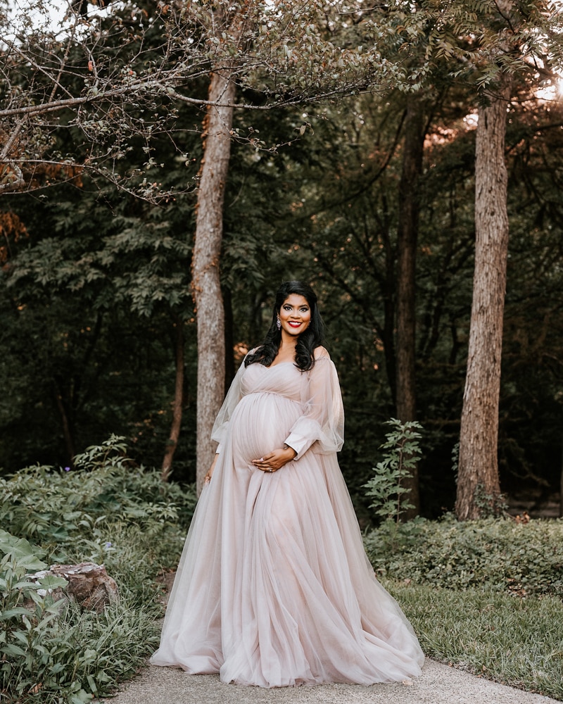 Pregnant Woman Smiling At Camera For Dallas Maternity Photographer