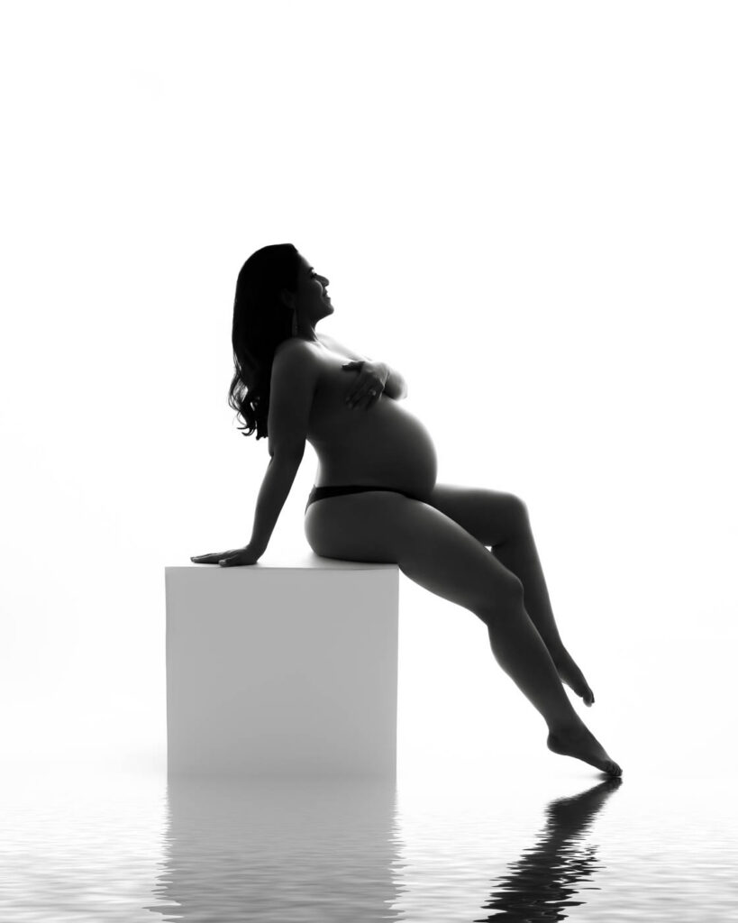 Why Families Choose Digital Maternity Photos 9 Artistic Black And White Maternity Photography Of Expecting Mother Seated During Dallas Studio Session