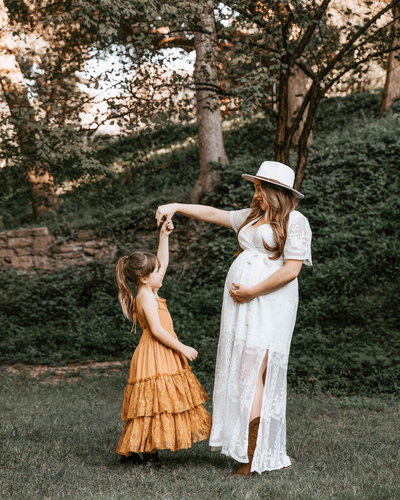 Why Sharing Your Pregnancy Journey Matters 7 Mother And Daughter During An Outdoor Maternity Photography Session In Dallas.