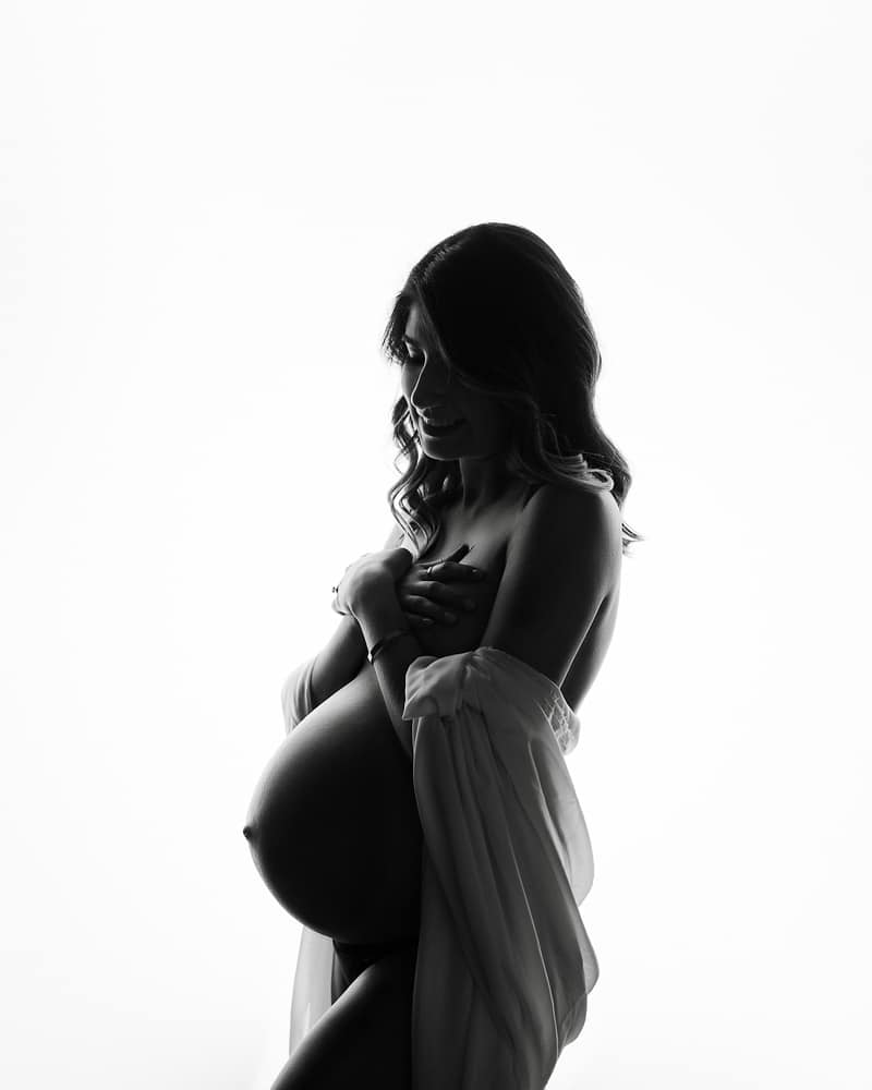 Maternity Silhouette Photography Of A Pregnant Woman, Partially Covered For Dallas Maternity Photographer