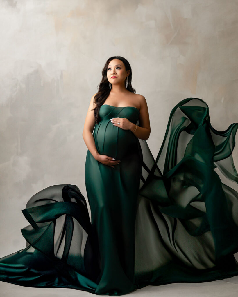How To Choose The Right Maternity Photographer In Dallas 12 Dallas Maternity Photographer Fine Art Studio Portrait With Elegant Flowing Green Gown