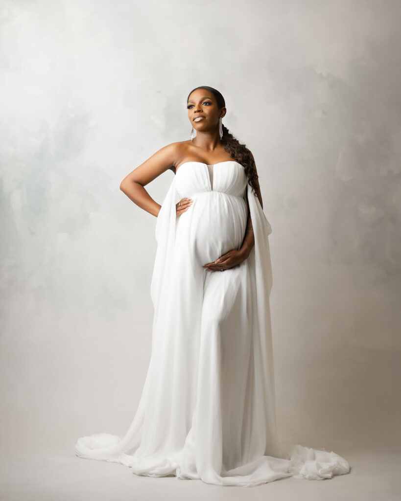What Happens After Your Maternity Session? From Proofing To Delivery 17 Dallas Maternity Photographer Studio Portrait Featuring Elegant White Maternity Gown