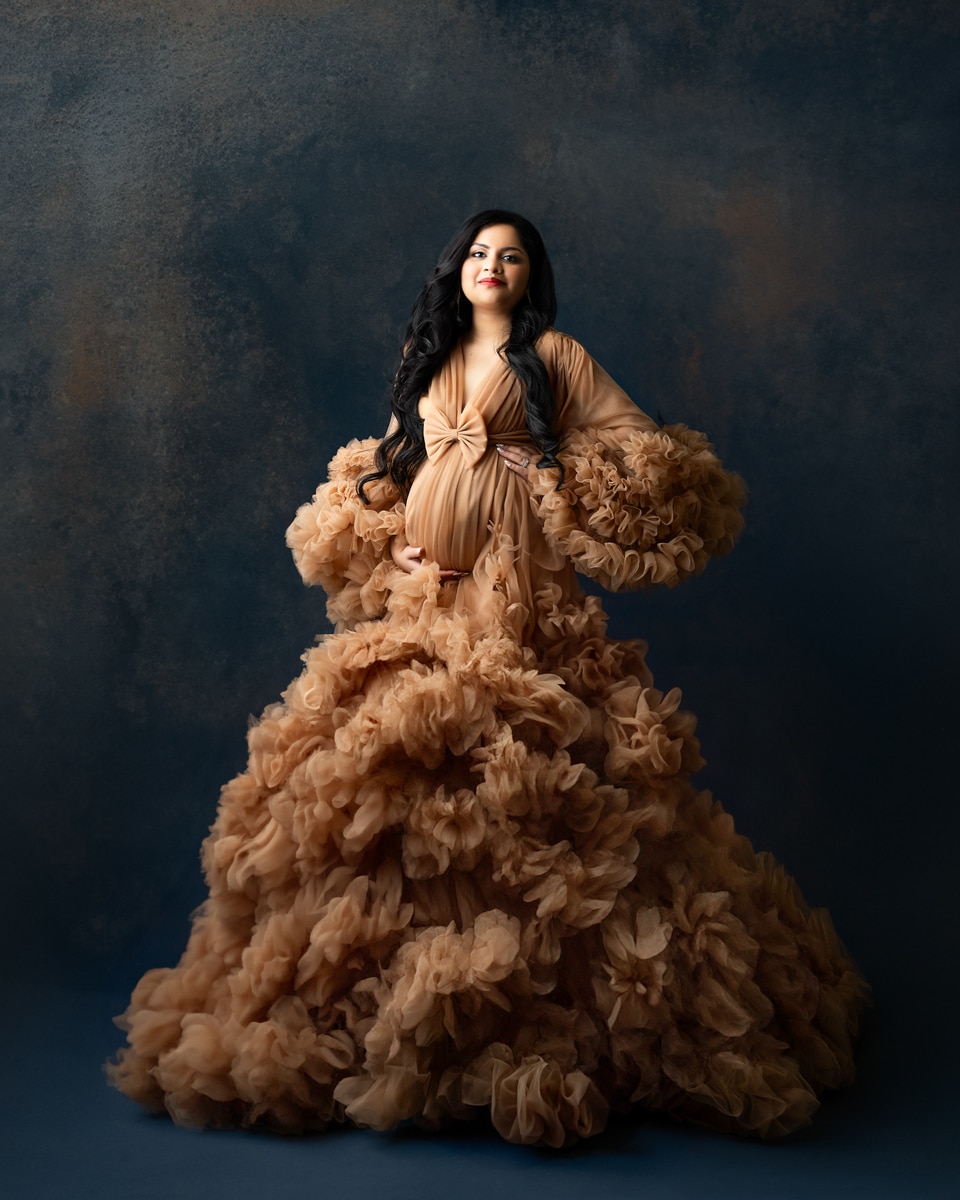 Pregnant Woman In Ruffled Brown Gown Poses Confidently For Dallas Maternity Photographer