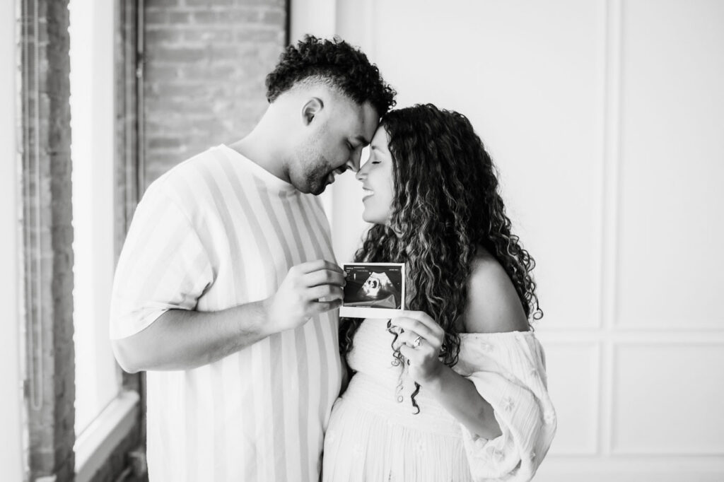 Why Experience Matters In Maternity Photography 6 Black-And-White Couple Portrait During A Maternity Photography Dallas Studio Session