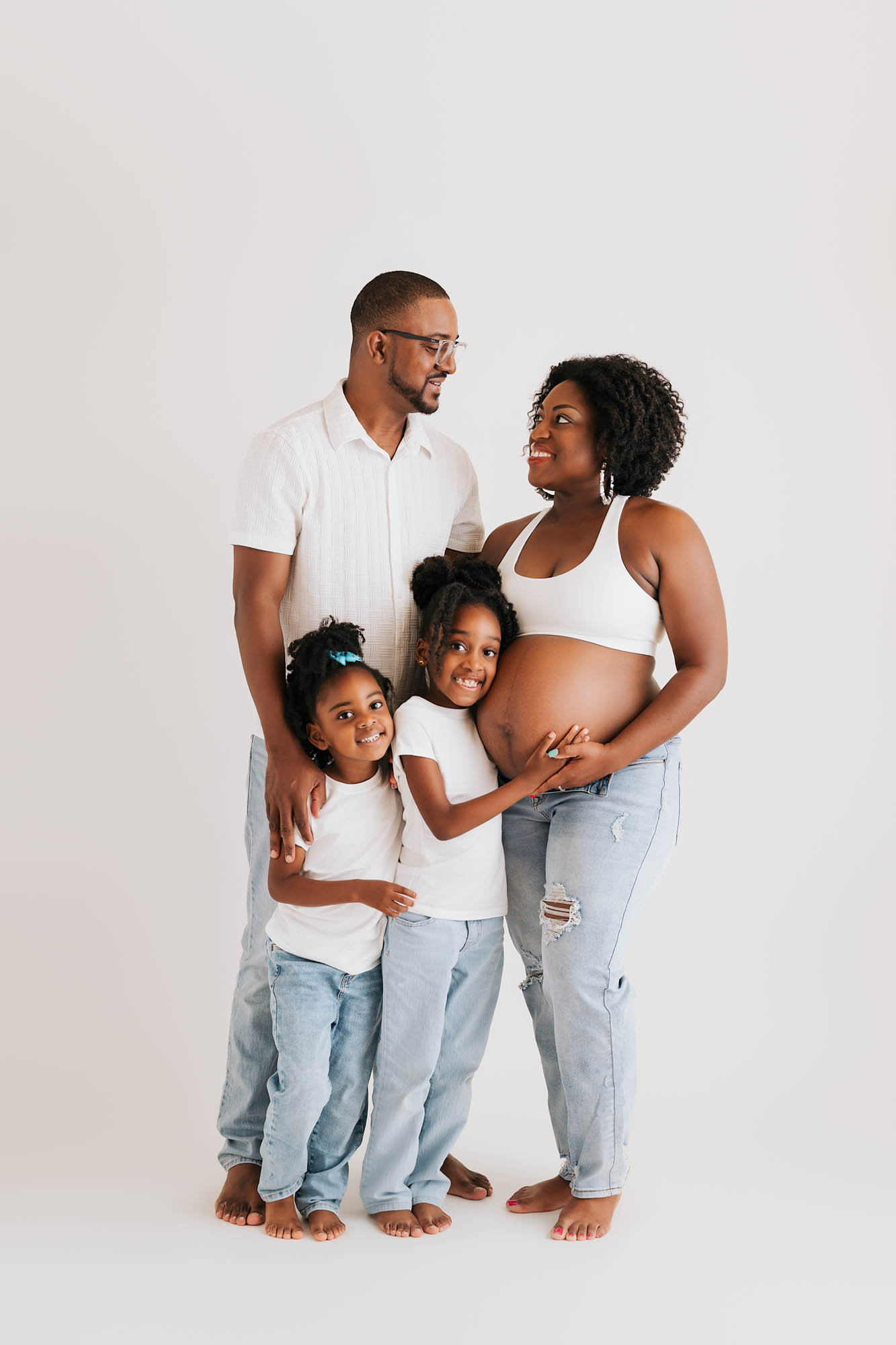 Family Maternity Portrait In Dallas Studio With Mom, Dad, And Daughters
