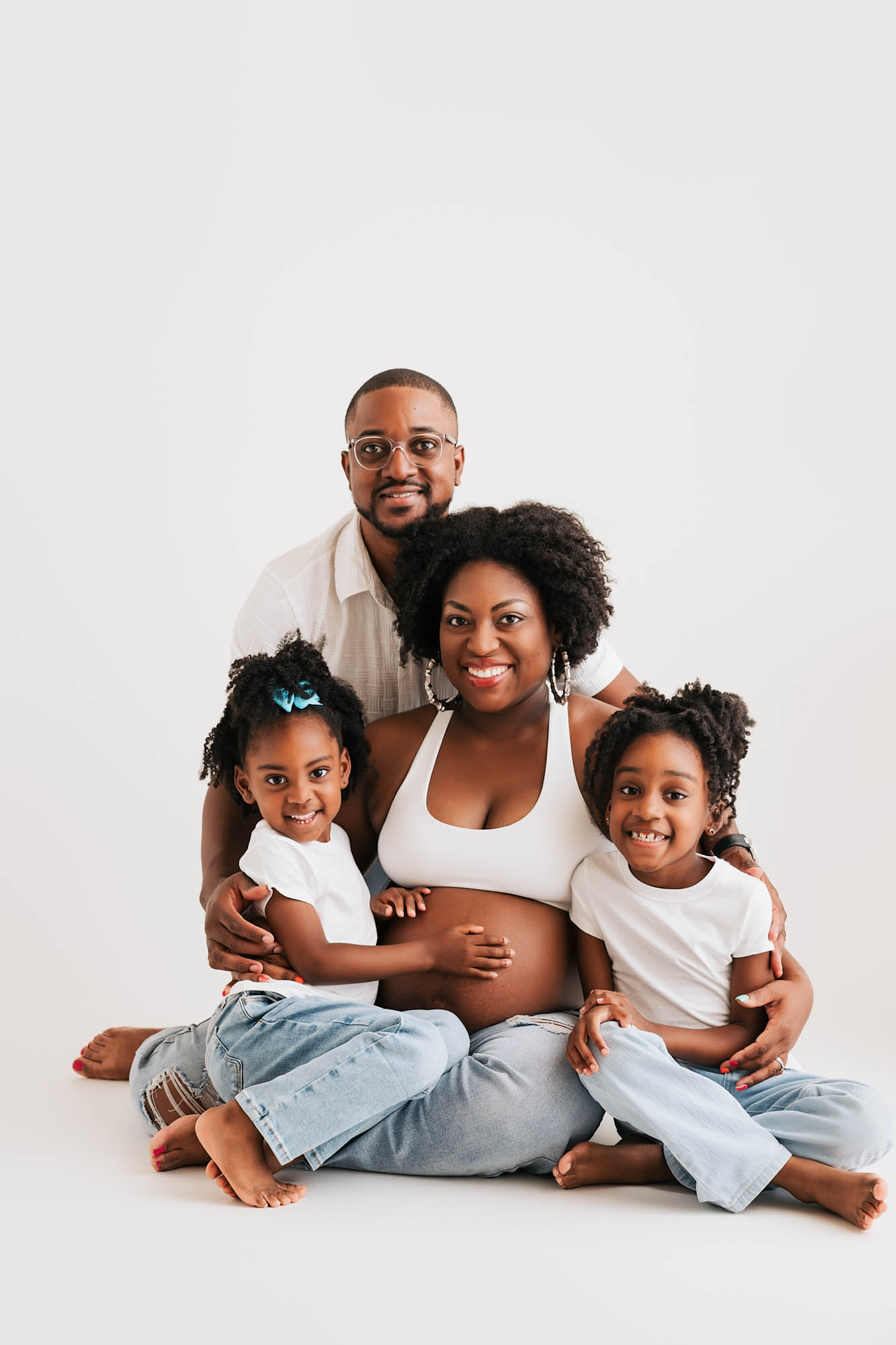 Smiling Family During Maternity Photoshoot In Dallas Studio 