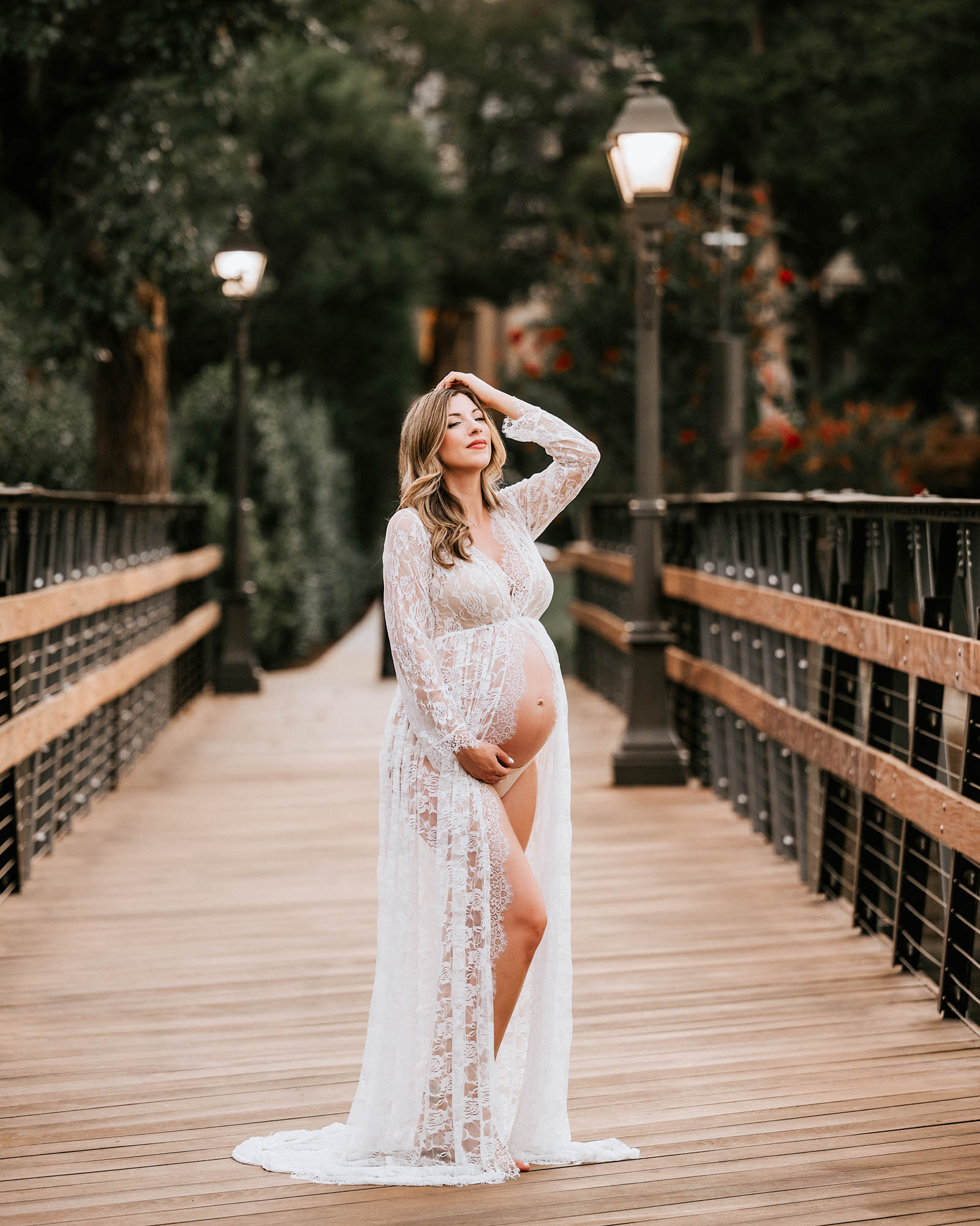 Maternity Photography | 5 Ways To Capture The True Essence Of Motherhood 1 Pregnant Woman In Lace Gown Showing Baby Bump During Intimate Dallas Maternity Session