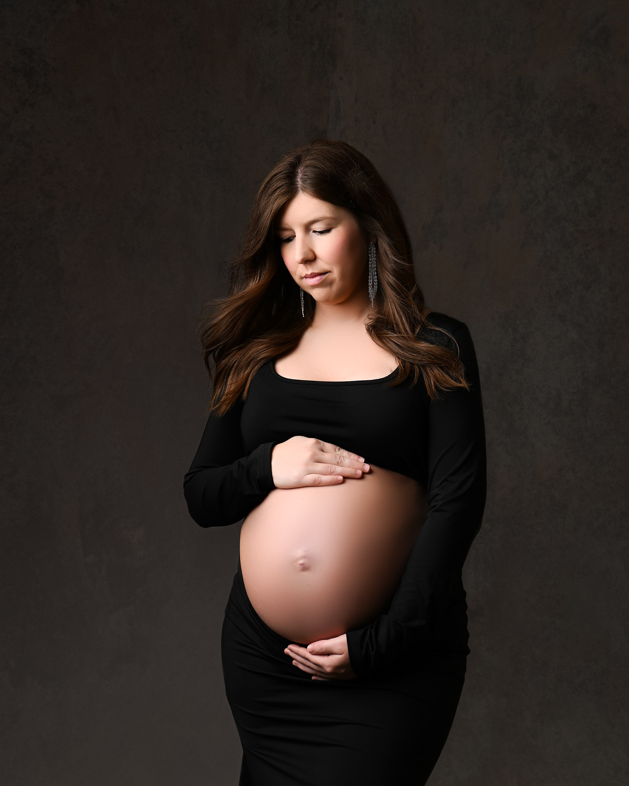 Beautiful Maternity Photo Of A Pregnant Woman In A Black Dress, Captured By A Dallas Maternity Photographer