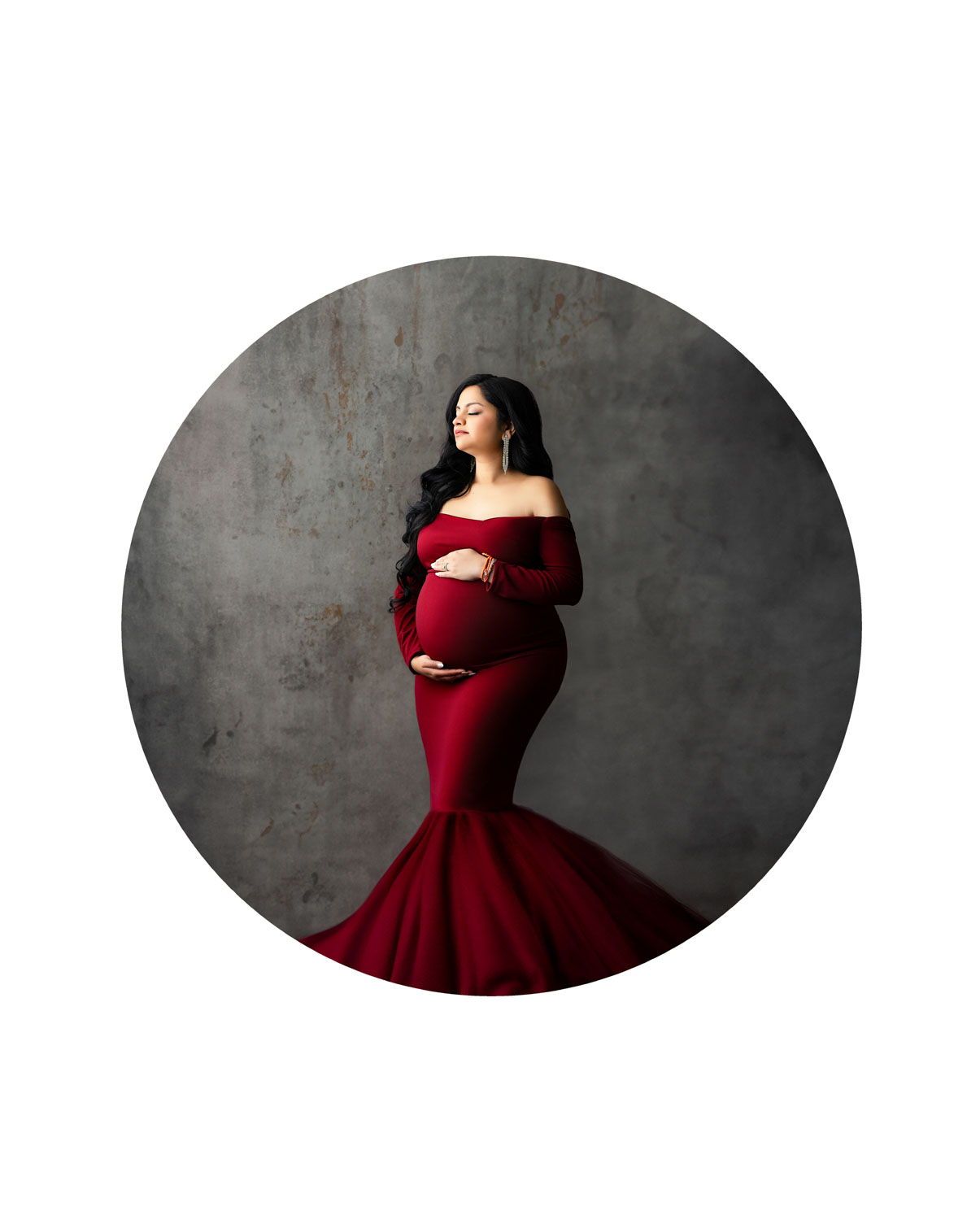 Fine art maternity photography in Dallas featuring an expectant mother in dramatic studio lighting