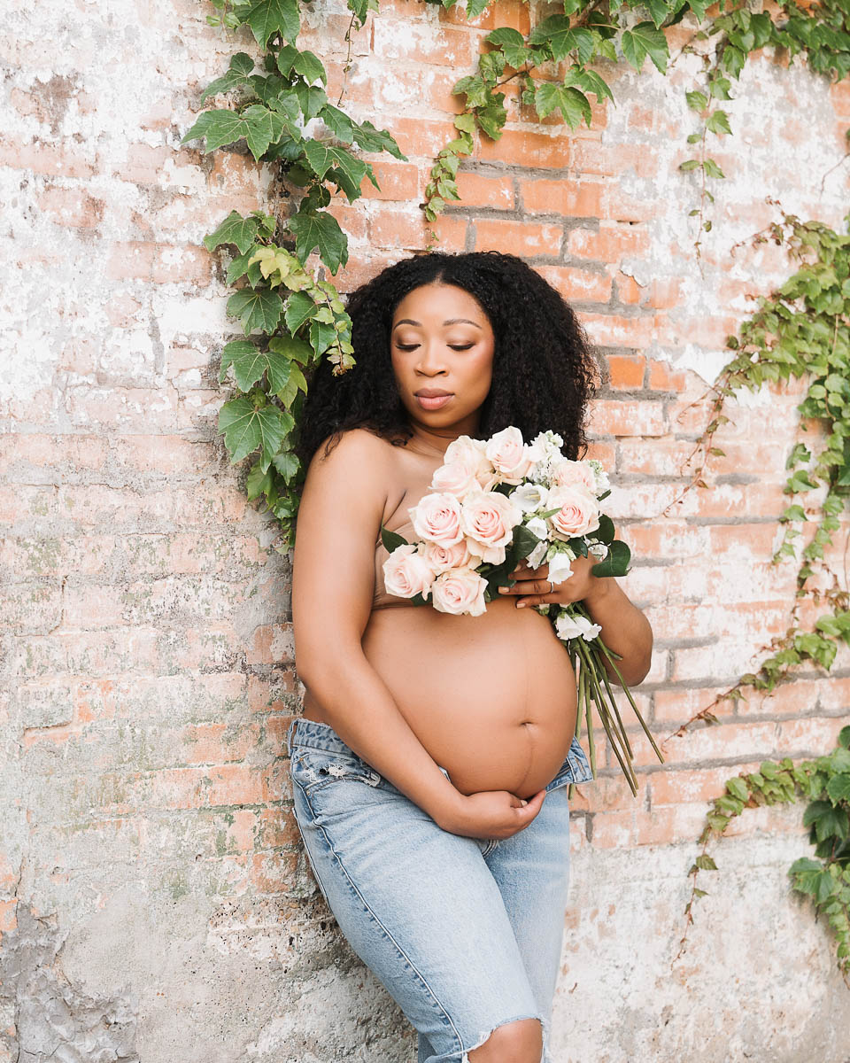 Dallas maternity photographer outdoor natural pregnancy portrait with soft florals and relaxed styling