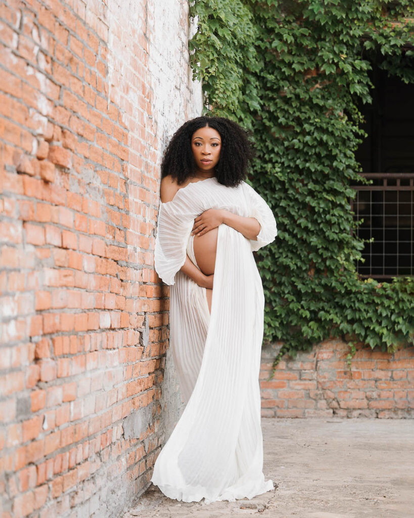 When Should You Schedule Maternity Photos? 8 Outdoor Maternity Session Dallas Brick Wall Elegant Portrait With Timeless Styling