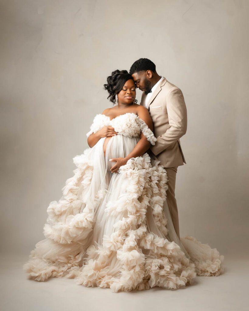 Dallas Maternity Photographer | Studio Maternity Portraits 8 Couple Posing Together During A Luxury Maternity Photography Session With An Ivory Couture Gown In Dallas.