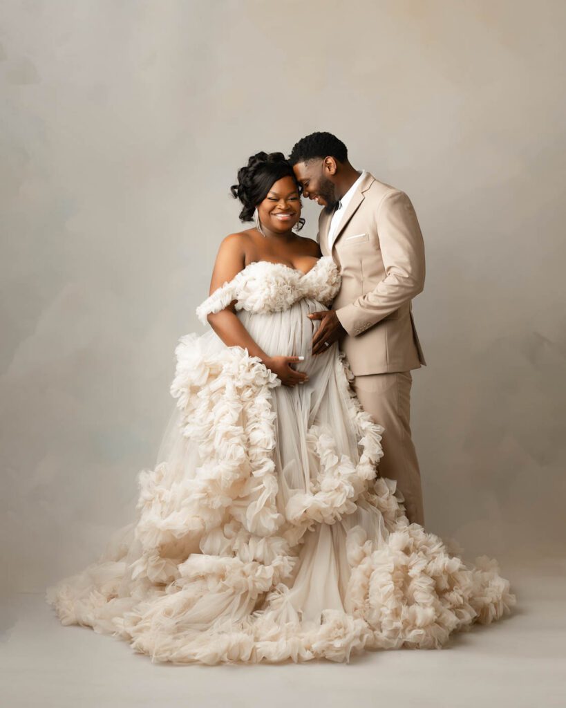 Dallas Maternity Photographer | Studio Maternity Portraits 7 Parents-To-Be Embracing During A Luxury Studio Maternity Photography Session In Dallas.