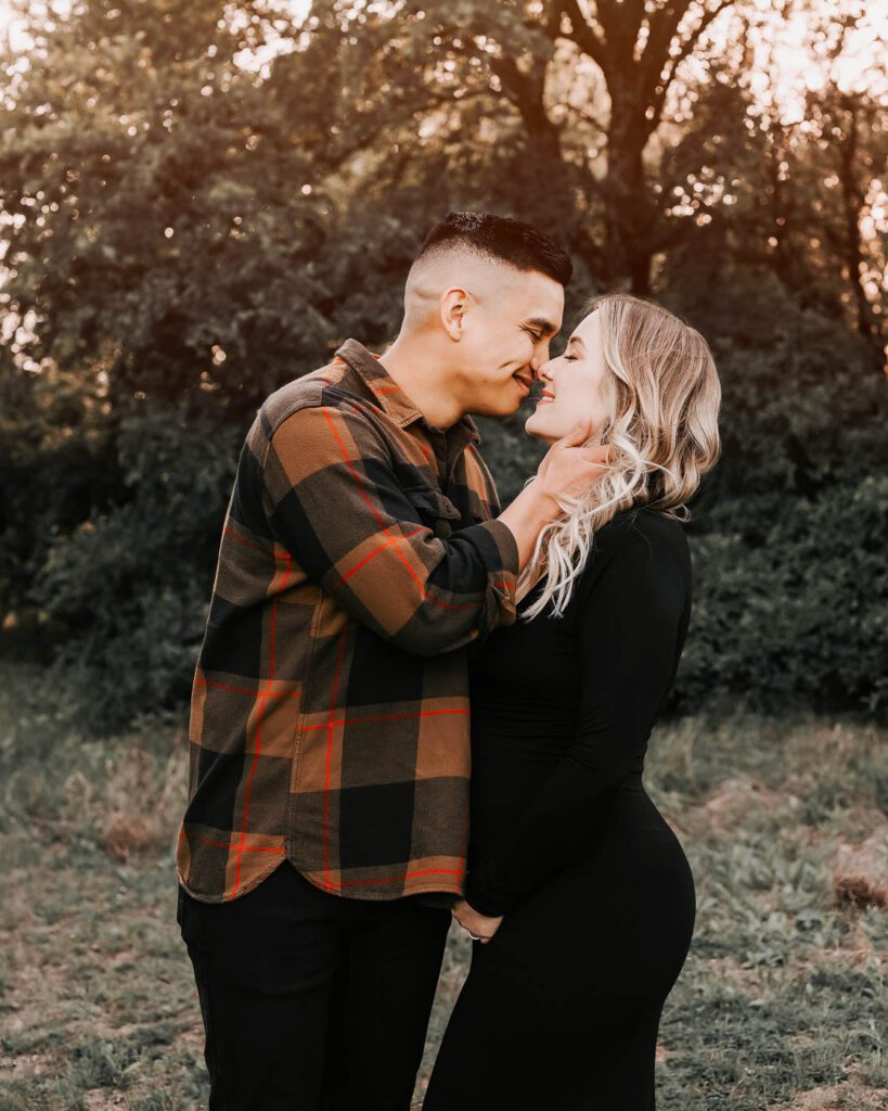 Maternity Photography Dallas Couple Standing Closely Together During An Outdoor Maternity Session