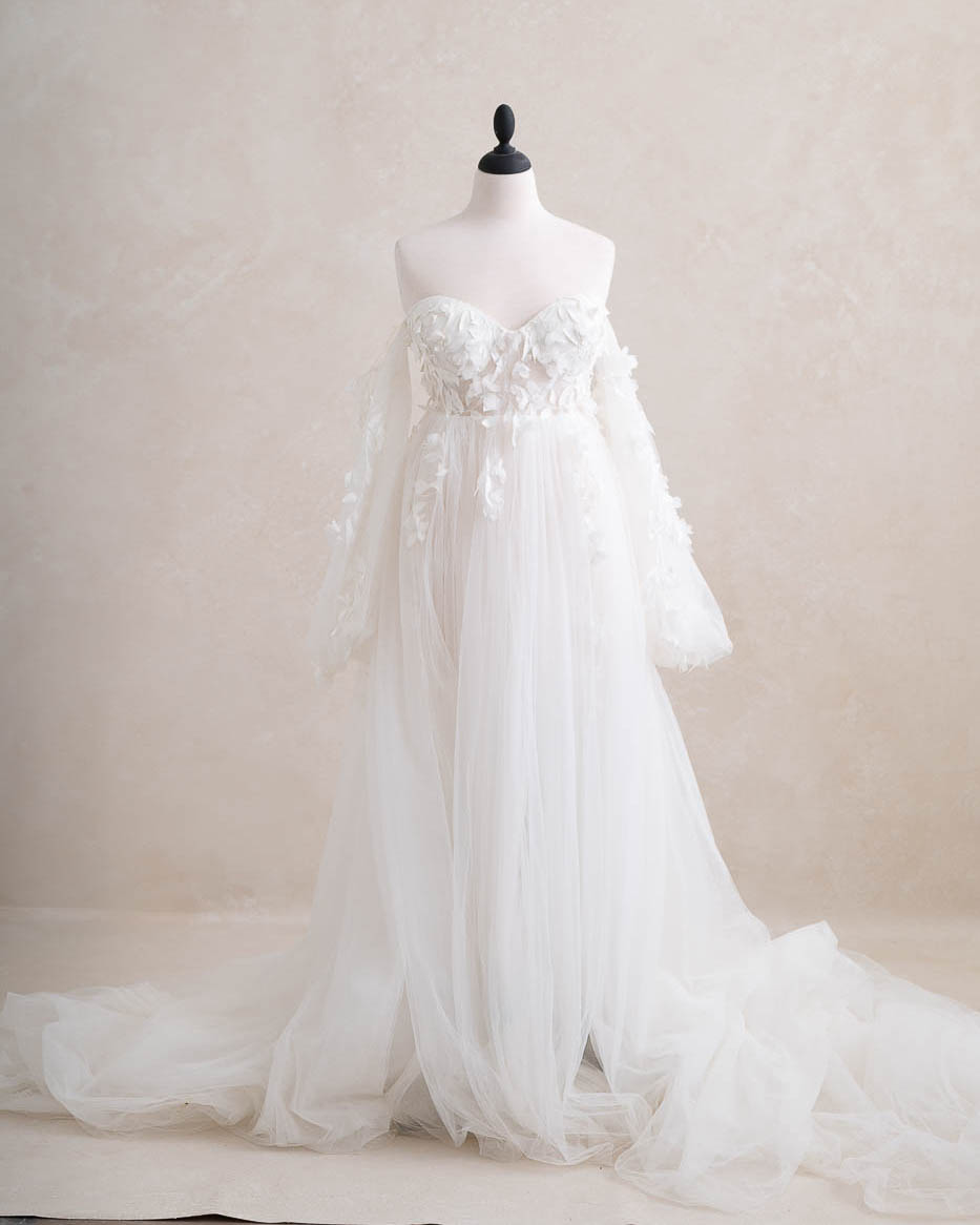 White couture maternity gown available with a Dallas maternity photographer for studio portraits