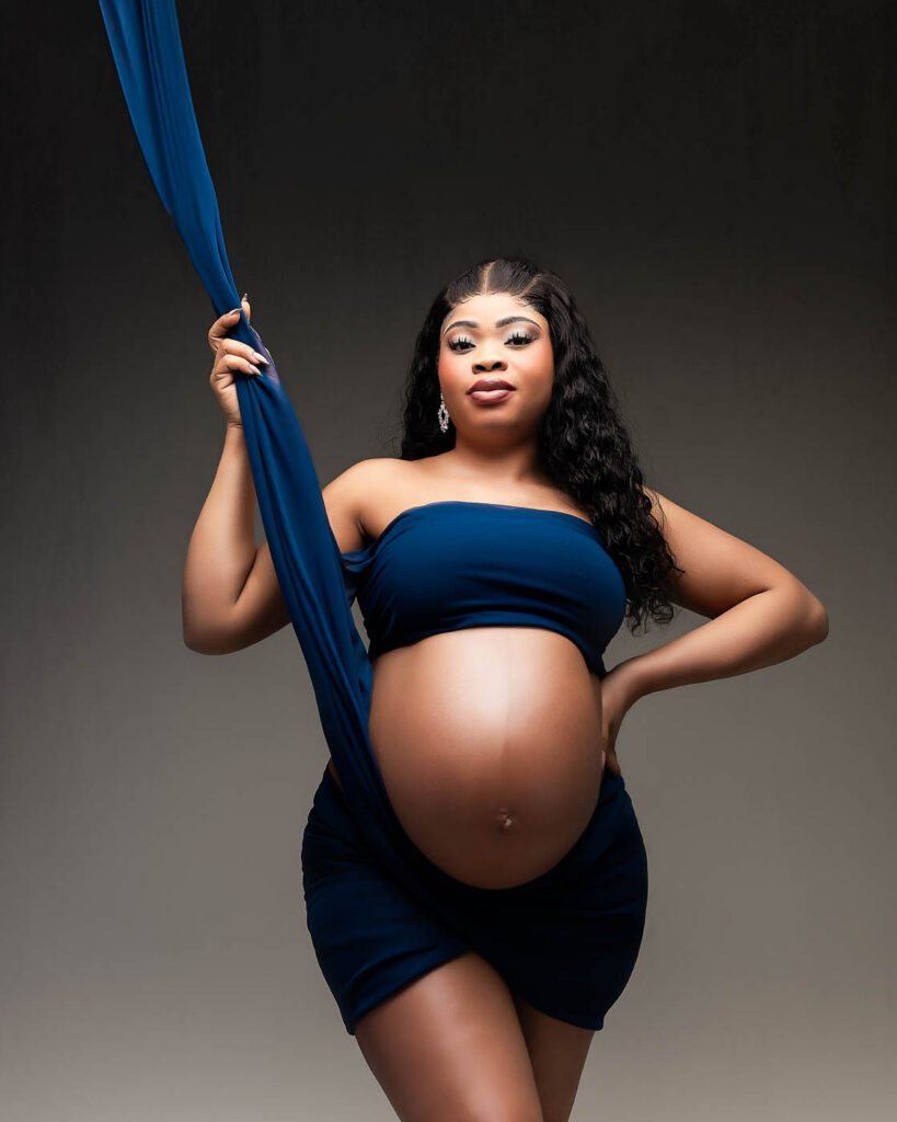 How To Prepare For Your Dallas Maternity Photoshoot 13 Dallas Maternity Photographer Creating A Blue Draped Fine Art Studio Maternity Portrait