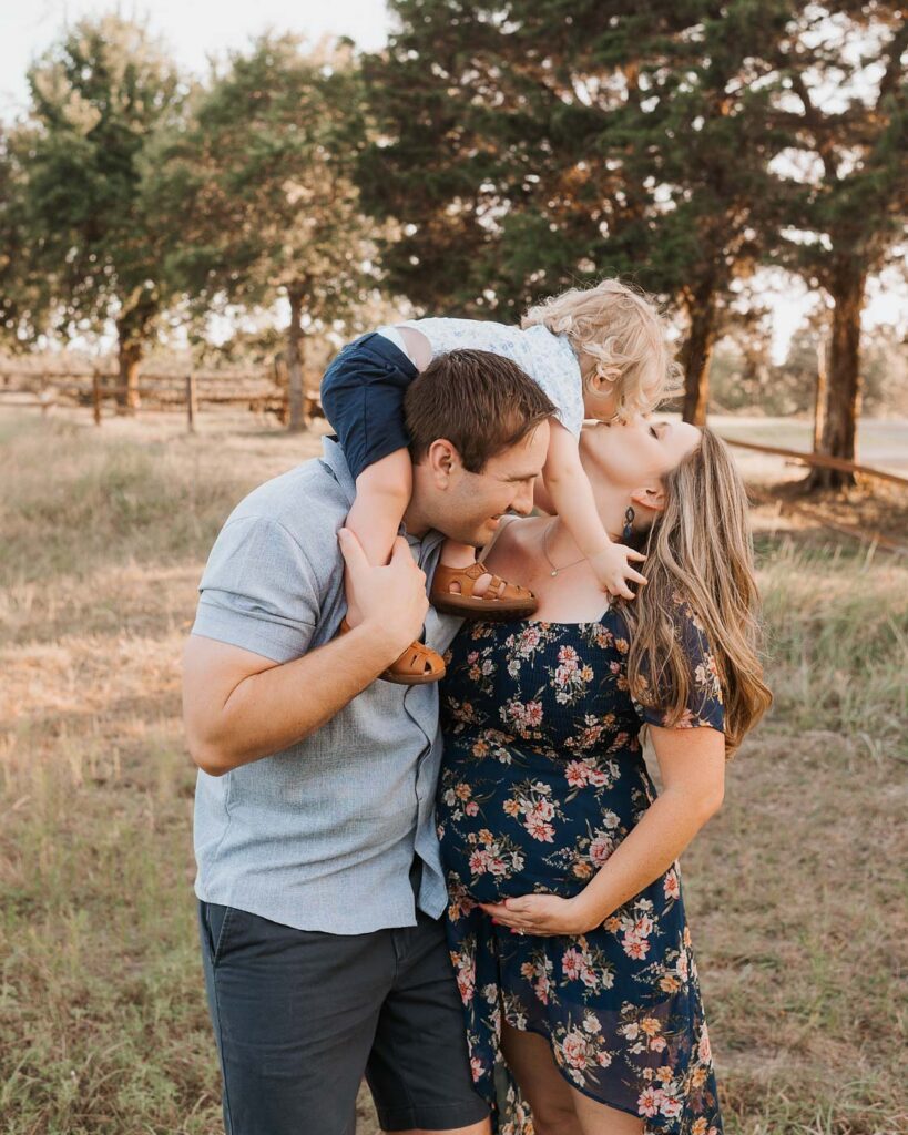 Outdoor Maternity Photos For Moms Who Want Something More Relaxed 16 Dallas Maternity Photography Featuring An Expecting Mom Interacting With Her Family During An Outdoor Maternity Session
